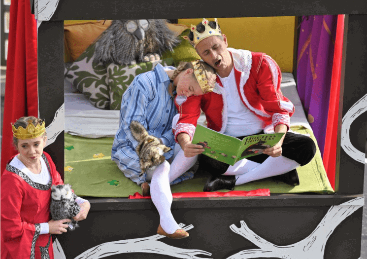 Bude Feb festival theatre scene showing a King father reading a story for his princess daughter