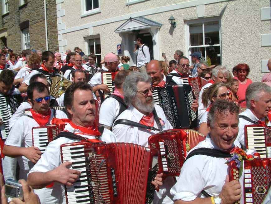 Accordionists playing on the street on Padstow's May Day Parade