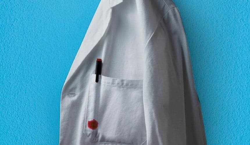 ADAM KAY THIS IS GOING TO HURT poster showing a doctor's white coat with a pen and red blood stain on the chest pocket