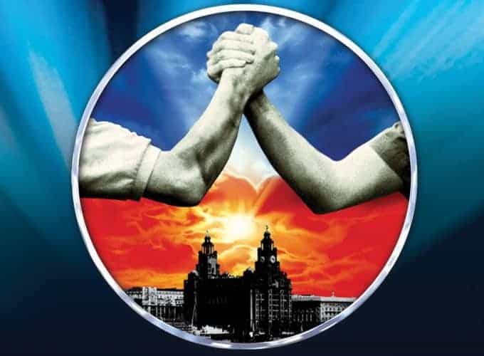 Poster for the Blood Brothers musical showing arms of two men in an arm wrestling pose with a dark orange sunset background