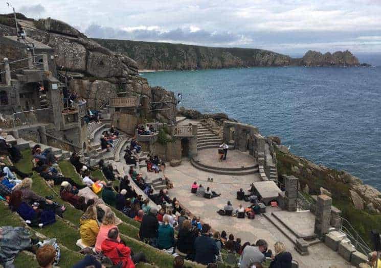 People watching a show in Minack Theatre
