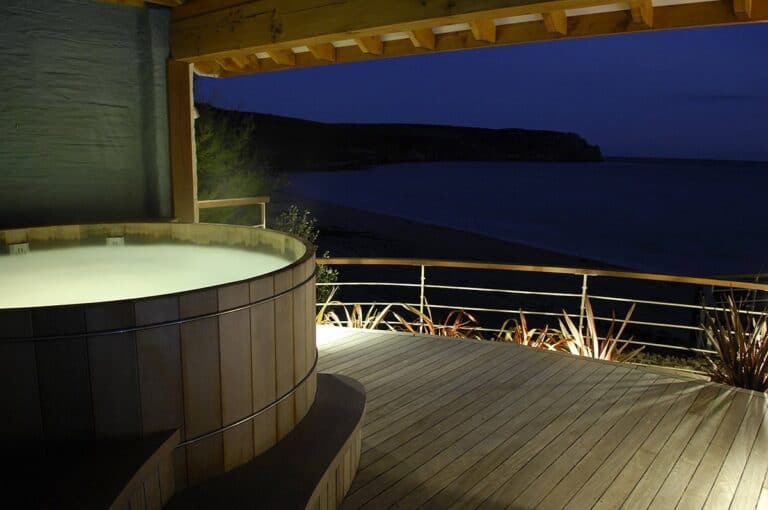 Evening view from coastal hot tub deck.