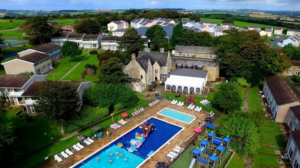 Aerial view of a rural holiday resort with pool